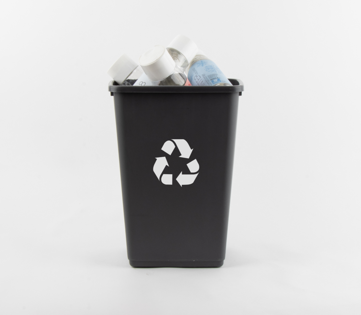 Recycling can with empty Maple Holistics bottles in it